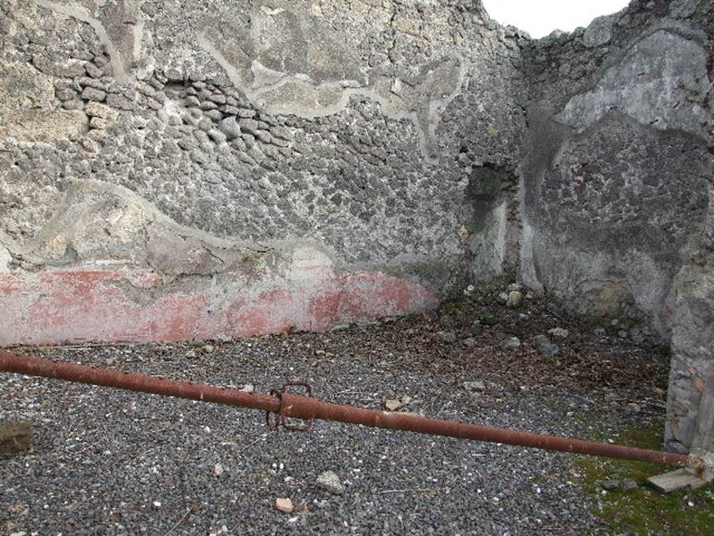 I.2.10 Pompeii. December 2006. Tablinum with remains of painted decoration on east wall..