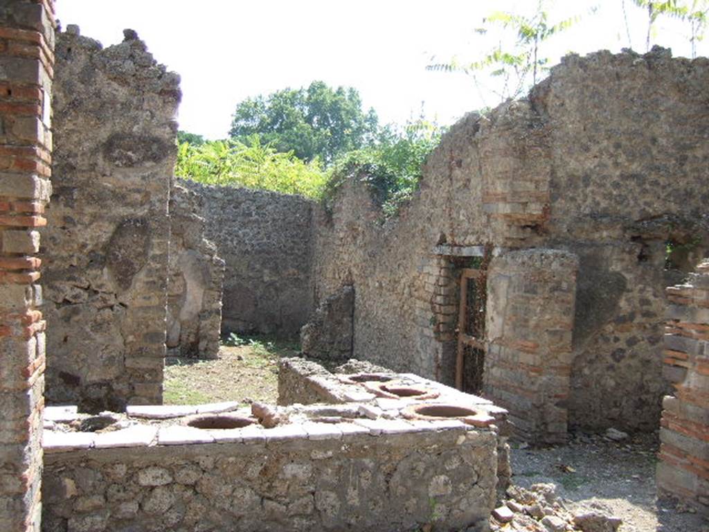I.2.18 Pompeii. September 2005.  Looking south to rear rooms, and door to I.2.17.
