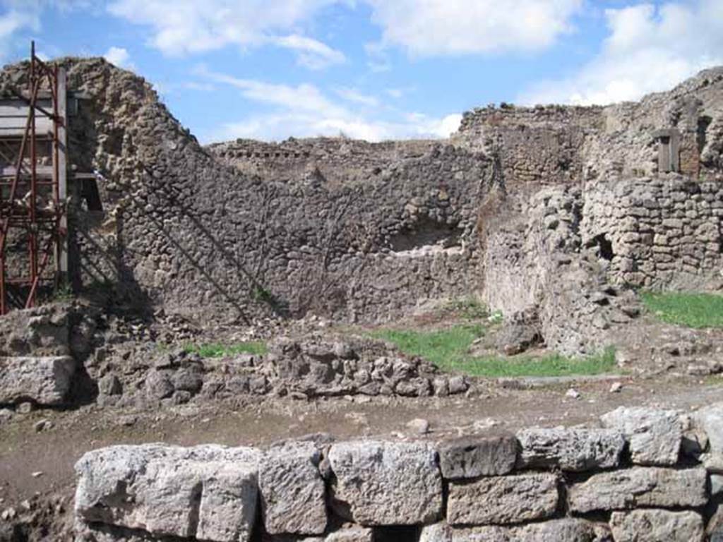 I.2.30 Pompeii. September 2010. Looking north to entrance doorway, with remains of perimeter wall, from across Vicolo del Conciapelle.
Photo courtesy of Drew Baker.
According to Fiorelli, near this doorway was another electoral recommendation relating to Numerio Popidio Rufo:             
                                  N.P.R
                             AED.O.V.F
See Pappalardo, U., 2001. La Descrizione di Pompei per Giuseppe Fiorelli (1875). Napoli: Massa Editore. (p. 34)

