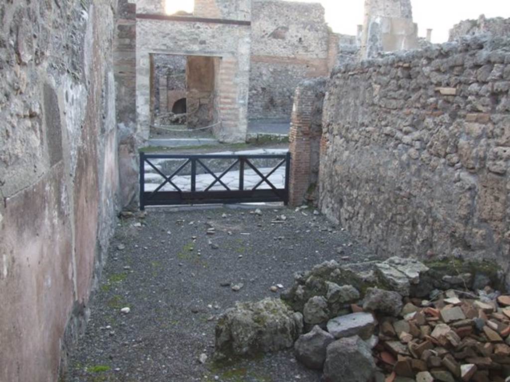 I.4.6 Pompeii. December 2007.  Looking west towards entrance across remains of wall separating rear room from shop.
