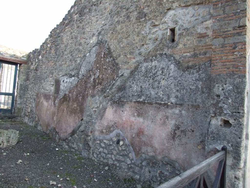 I.4.6 Pompeii. December 2007. South wall of shop, with site of stairs to upper floor visible in the plasterwork.