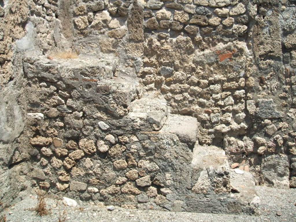 I.4.8 Pompeii. May 2005. Steps to upper floor, against the east wall of the shop.