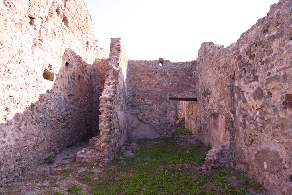 I.4.11 Pompeii. October 2019. Looking east towards area under stairs to upper floor, with latrine, on left, and rear room, on right.
Foto Tobias Busen, ERC Grant 681269 DÉCOR.
