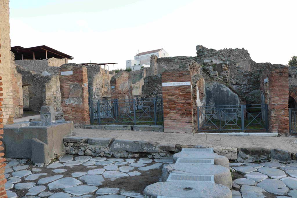 I.4.14 Pompeii, on right. December 2018. Looking east towards entrance doorways of I.4.15 and I.4.14, on right.
They are on the south-east corner of the crossroads of Holconius, the east side of Via Stabiana. Photo courtesy of Aude Durand.

