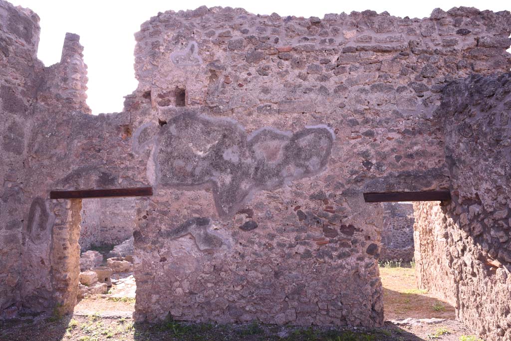 I.4.17 Pompeii. October 2019. 
Looking towards south wall of shop-room, with doorway to I.4.12, on left, and door to I.4.13, on right.
The doorway on the left leads into room h of I.4.12 and can be seen on the page for that number.
The doorway on the right leads into room b of I.4.13 and can be seen on that number.
Foto Tobias Busen, ERC Grant 681269 DÉCOR.

