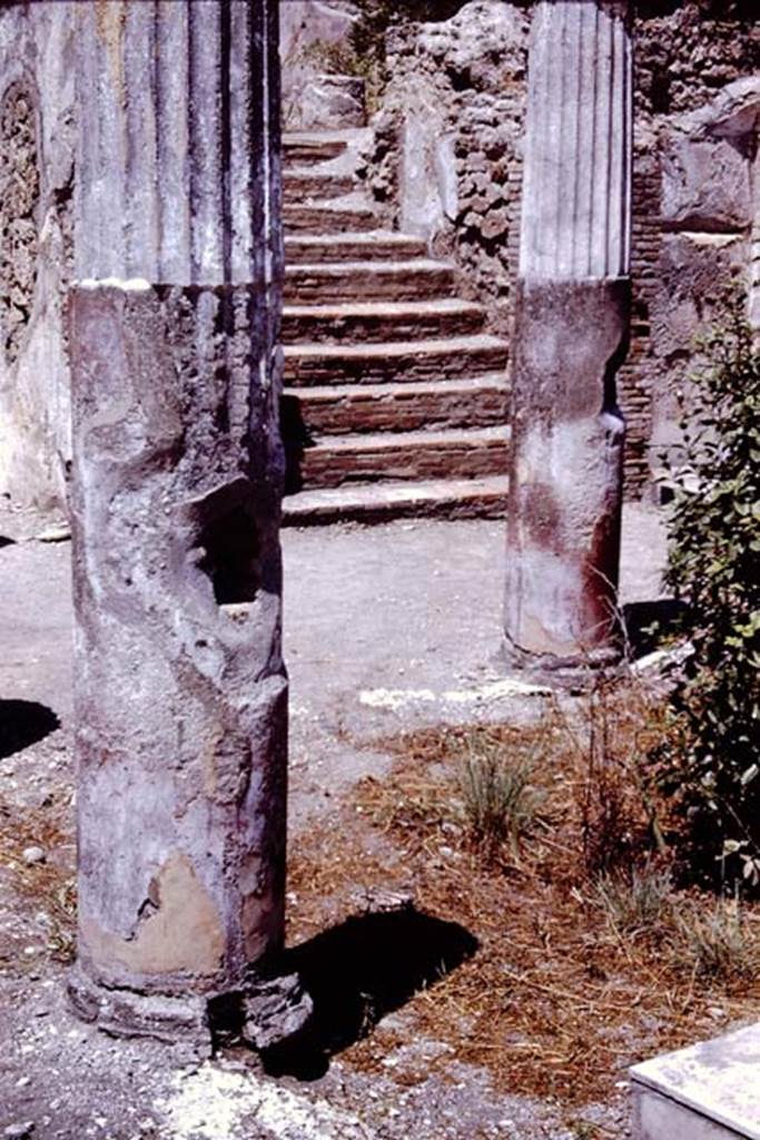 I.4.25 Pompeii. 1966. 
Middle peristyle 17, with steps to upper peristyle 56 in north-west corner. Photo by Stanley A. Jashemski.
Source: The Wilhelmina and Stanley A. Jashemski archive in the University of Maryland Library, Special Collections (See collection page) and made available under the Creative Commons Attribution-Non Commercial License v.4. See Licence and use details.
J66f0570
