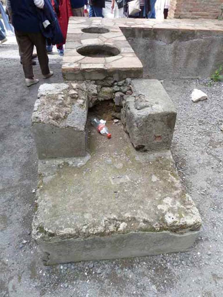 I.4.27 Pompeii. May 2010. Hearth and counter, from rear.