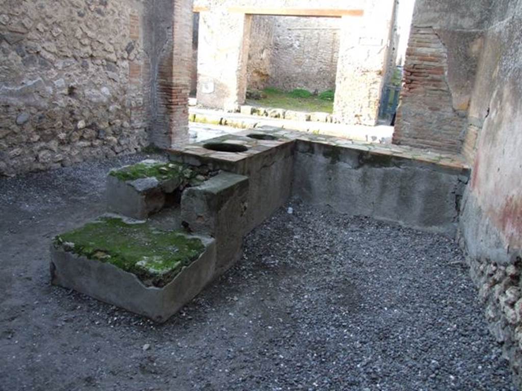 I.4.27 Pompeii. December 2007. Counter with two urns and hearth.