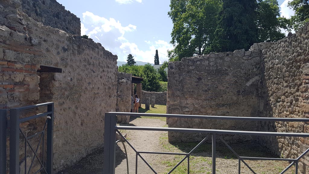 I.5.2 Pompeii. August 2023. Looking south through entrance doorway into shop-room. Photo courtesy of Maribel Velasco.

