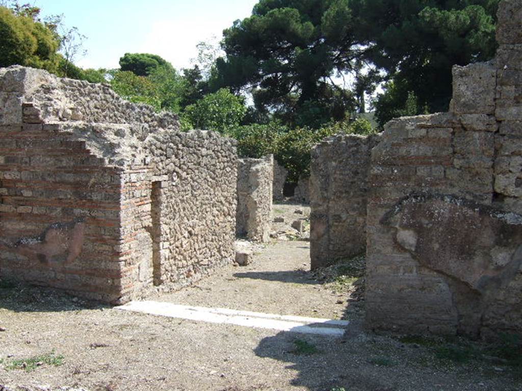 I.5.2 Pompeii. September 2005. Entrance.  According to Cooley, a graffito inscription written in carbon, was found on the wall of the shop-room leading to the tannery reading: Tannery of Xulmus    [CIL IV 4014]
See Cooley, A. and M.G.L., 2004. Pompeii : A Sourcebook. London : Routledge. (p. 178)

According to Della Corte, written in the entrance was the graffito -
Xulmi  Cor(i)ariano     [CIL IV 4014]

Found in big letters to the left of the entrance –
M(arcus)  Vesoni  (Primi)  vos….     [CIL IV 4012]
See Della Corte, M., 1965.  Case ed Abitanti di Pompei. Napoli: Fausto Fiorentino. (p.275)

