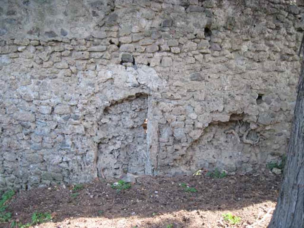 I.5.2 Pompeii. September 2010. South wall. Detail of blocked up doorway (right side of wall) leading to unnamed vicolo running between I.V and city walls looking south towards wall.  Photo courtesy of Drew Baker.
