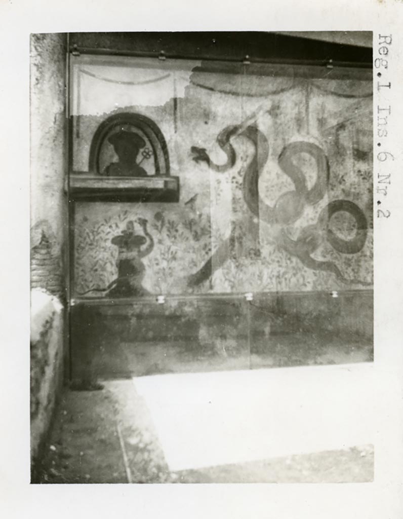 I.6.2 Pompeii. Pre-1937-39. Painted lararium on west wall near portico.  
Photo courtesy of American Academy in Rome, Photographic Archive. Warsher collection no. 1569.
