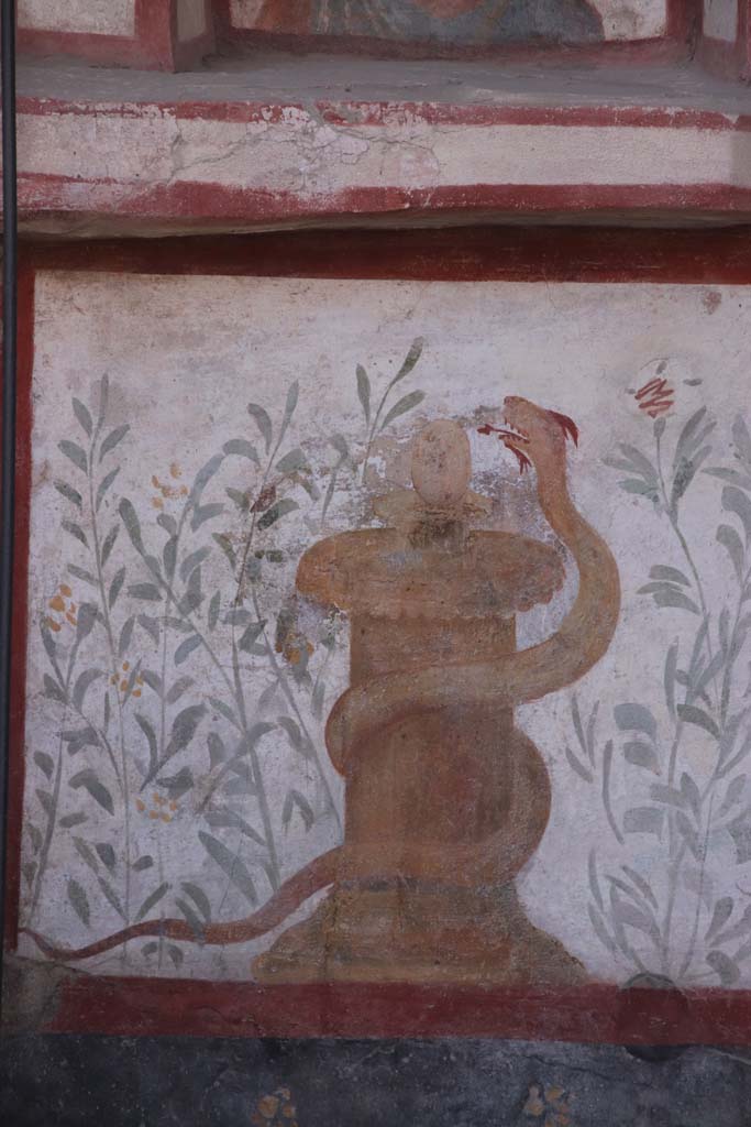 I.6.2 Pompeii. September 2021. 
Painted altar with small serpent, at the south end of the painted lararium beneath Mercury. 
Photo courtesy of Klaus Heese.
