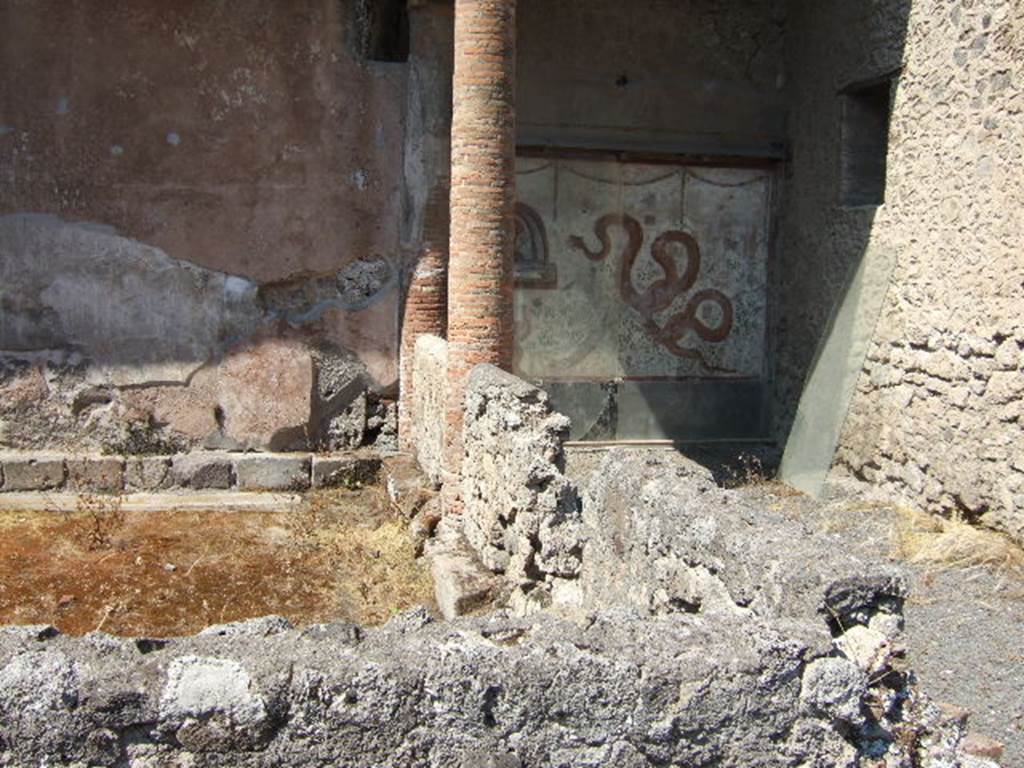 I.6.2 Pompeii. May 2006. Small peristyle garden on the south side of the lararium. The garden was enclosed on the north and east sides by a low wall built between 5 brick columns. These columns used to be covered with white stucco. See Jashemski, W. F., 1993. The Gardens of Pompeii, Volume II: Appendices. New York: Caratzas. (p. 34) 
