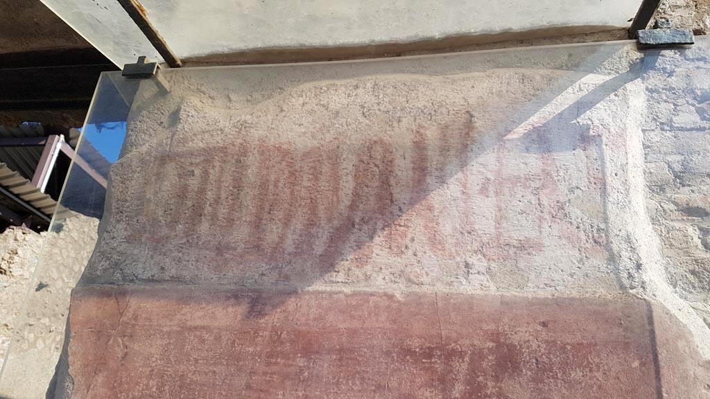 I.6.6 Pompeii. August 2023. Painted graffito on the west side of the entrance. Photo courtesy of Maribel Velasco.