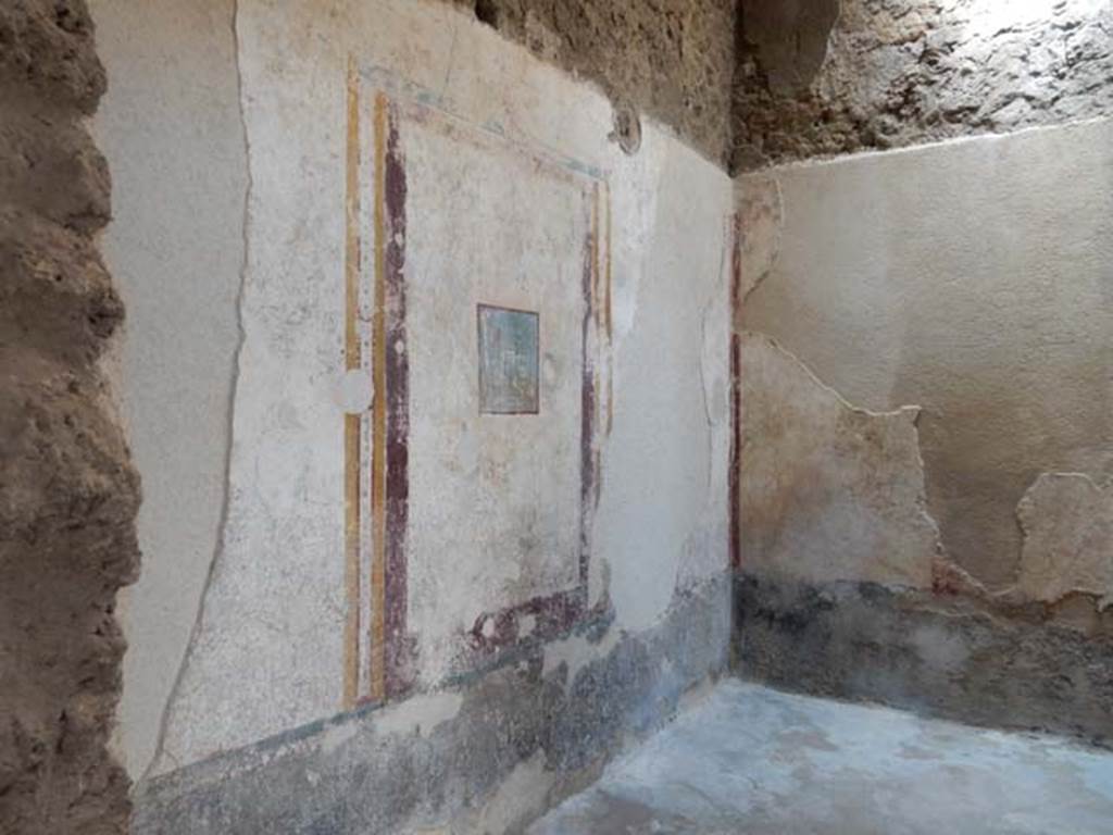 I.7.1 Pompeii. May 2016. Cubiculum on east side of fauces/vestibule, Looking towards north wall and north-east corner of the cubiculum through hole made in east wall of fauces/vesgtibule. The zoccolo/lower level of the wall would have been painted black and the middle zone of the wall was white. In the centre was a painted panel of a sacred landscape (35 x 33, III Style). Photo courtesy of Buzz Ferebee.
