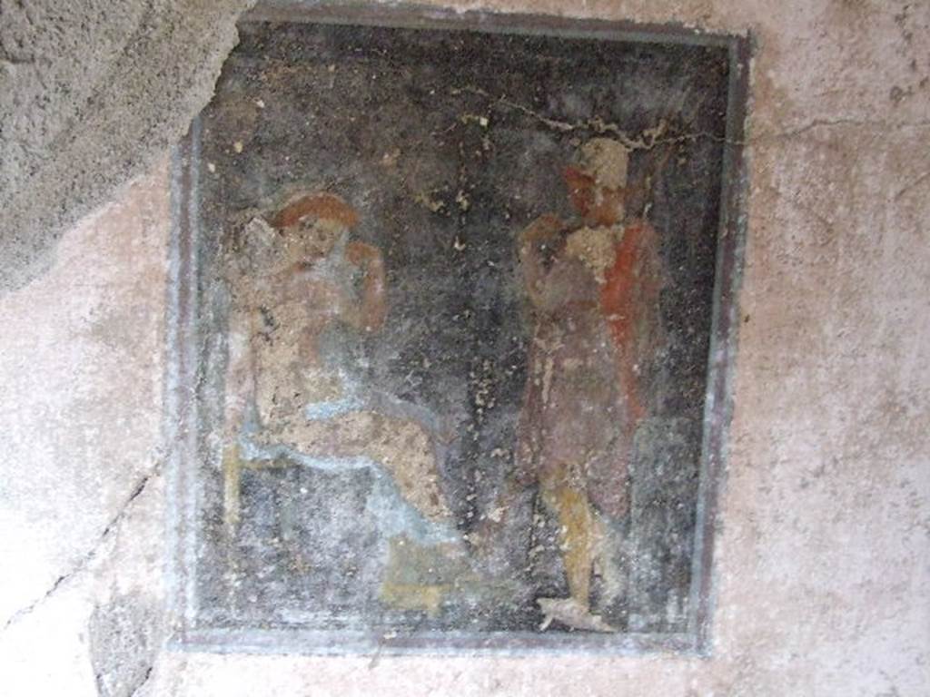 I.7.19 Pompeii. December 2006. Cubiculum on north side of corridor. Wall painting of Helen and Paris from north wall. Helen, with a golden head of hair, and wearing an ample mantle sits with her feet on a stool. She is in the act of a bride revealing her face and breasts to the young Paris. Paris stands, wearing a Phrygian cap, Exomis (short tunic), shin guards and holding two lances. His gaze is fixed intently on her. See Notizie degli Scavi di Antichità, 1929, p. 366-7 and Fig. 6.