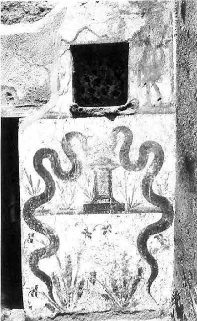 I.8.10 Pompeii. March 2009.  Lararium.  Remains of wall painting of serpent.  There were two serpents, one either side of a round altar.  The horizontal line, on which the base of a round altar rested, was about halfway up the serpent’s body.
