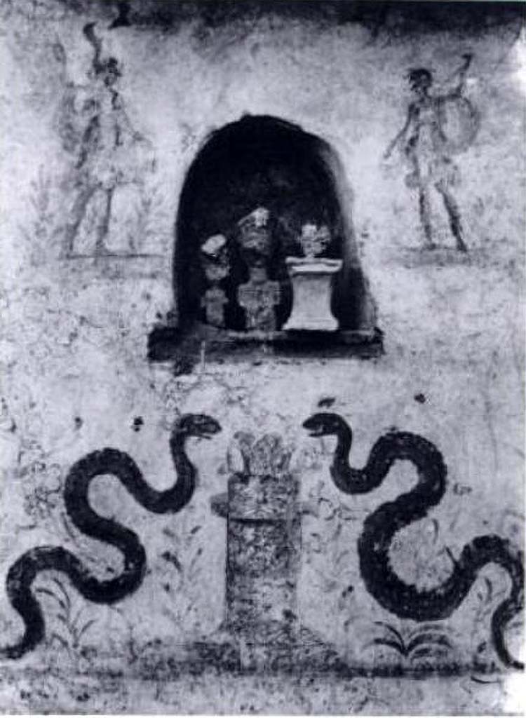 I.8.18 Pompeii. Old photo of lararium on the south wall in the kitchen.
According to Giacobello, this is the lararium in the kitchen of I.8.18.
She shows a contemporary photograph to confirm this.
According to Fröhlich, in a 1941 archive photograph it was said to be in the atrium of I.8.17 Casa dei Quattro Stili.
He considered the niche remaining in I.8.17 did not have enough room on its left side to fit in the left Lar and serpent.
He attributed it to an unspecified house in insula I.8, because from 1937 to 1941 this was the only place excavations took place.
See Giacobello, F., 2008. Larari Pompeiani: Iconografia e culto dei Lari in ambito domestico. Milano: LED Edizioni. (p.142).
See Fröhlich, T., 1991. Lararien und Fassadenbilder in den Vesuvstädten. Mainz: von Zabern. (L10, p.254, Taf. 25,3).
