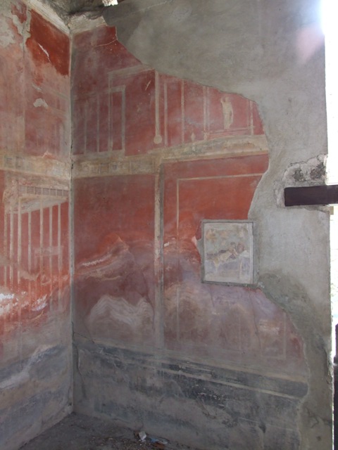 I.9.1 Pompeii.  March 2009.  West wall south of door, upper part.  