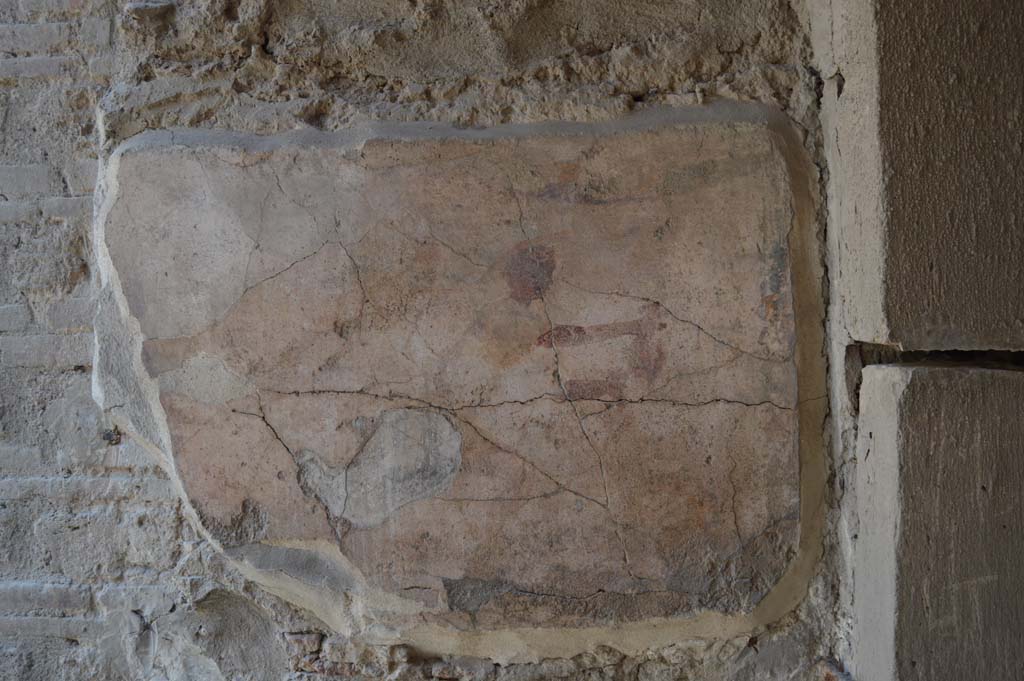 1.9.1 Pompeii. December 2018. East wall of vestibule, detail of remains of wall painting of Mercury. Photo courtesy of Aude Durand.