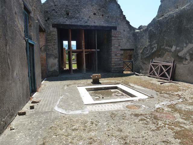 I.9.1 Pompeii. December 2018. 
Room 1, looking south across impluvium in atrium towards tablinum. Photo courtesy of Aude Durand.

