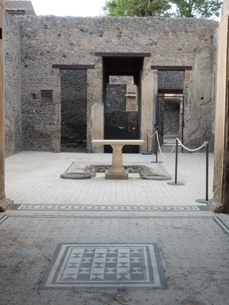 I.9.5 Pompeii. May 2017. Room 8, looking north from tablinum across atrium towards doorways to rooms on either side of entrance corridor. Photo courtesy of Buzz Ferebee.
