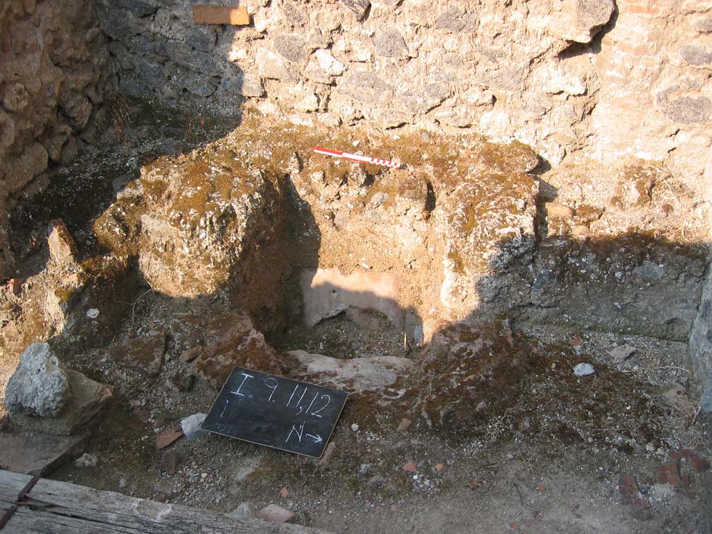 I.9.11 Pompeii. July 2006. Looking towards latrine in rear west room. Photo courtesy of Barry Hobson.