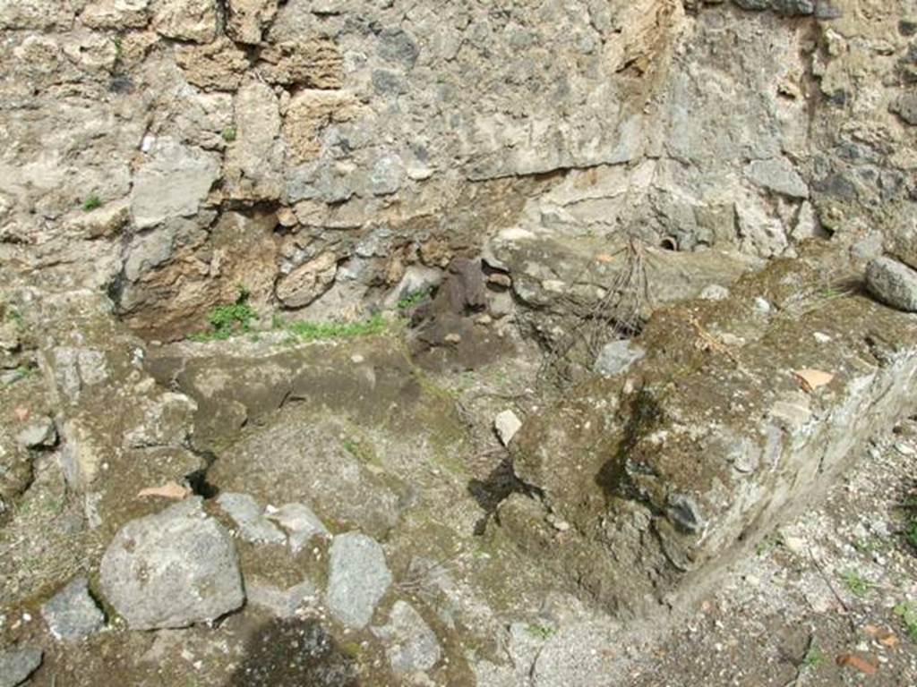 I.9.11 Pompeii.  March 2009.  North east corner of yard area, with remains of  brick walls.