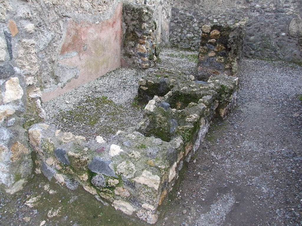 I.10.2 Pompeii. December 2006. Remains of podium, originally with two dolia and a hearth. 