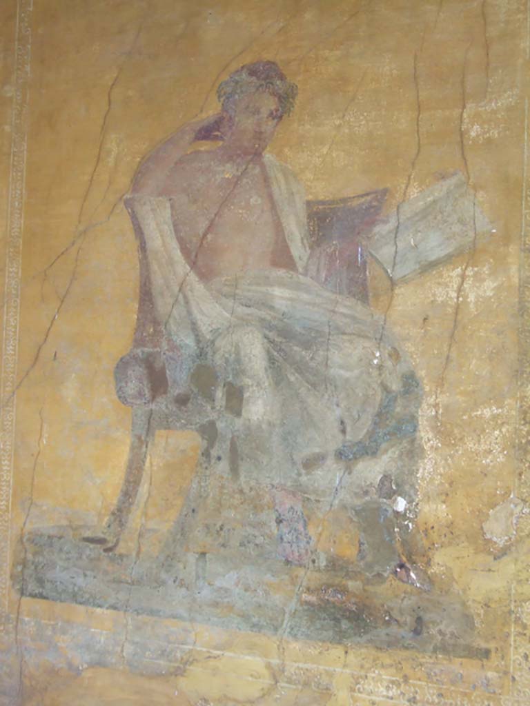 I.10.4 Pompeii. May 2006. Alcove 23, wall painting of poet. 
The name of Menander was inscribed by the painter on the skirt of the mans cloak. (CIL IV 7350a) 
See Cooley, A. and M.G.L., 2004. Pompeii: A Sourcebook. London: Routledge. (p. 70) 
