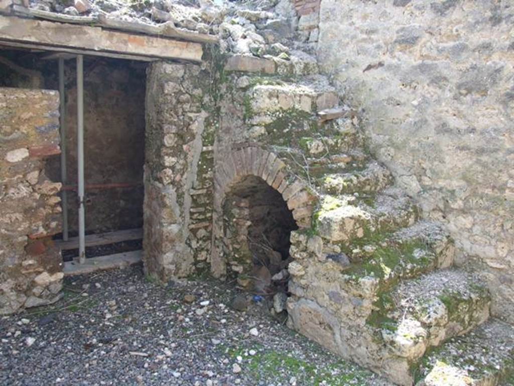 I.10.8 Pompeii. March 2009. Room 5, south-west corner of the yard, with stairs to upper gallery and cupboard under, and doorway to small room.
