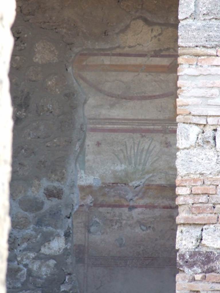 I.10.8 Pompeii. December 2007. Painted plaster on south wall in tablinum.  