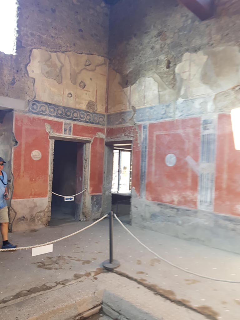 I.10.11 Pompeii. October 2022. 
Room 2, looking across impluvium and flooring towards north-west corner of atrium. Photo courtesy of Klaus Heese.
