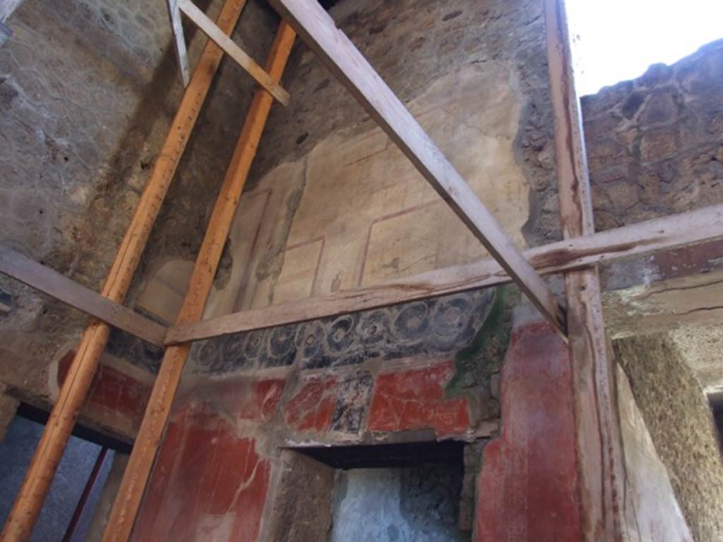 I.10.11 Pompeii. March 2009. Room 2, west wall of atrium. Painted wall at south end above room 3 doorway.