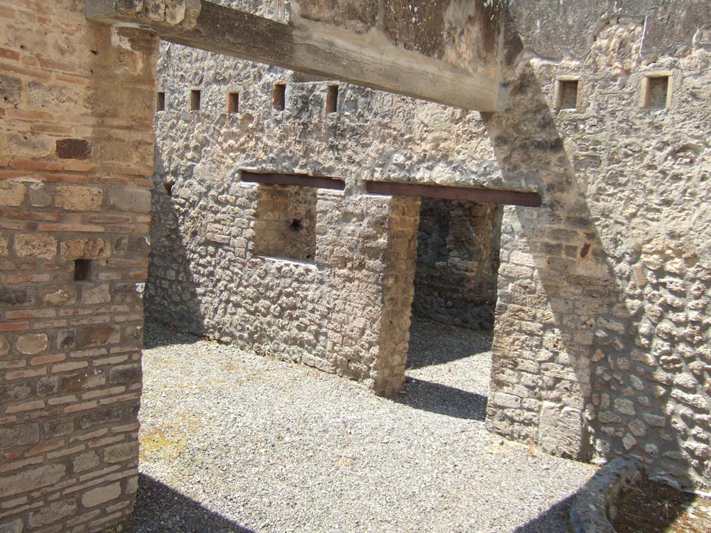I.10.14 Pompeii. May 2006. Doorway and window in west wall of stable, looking south-west.