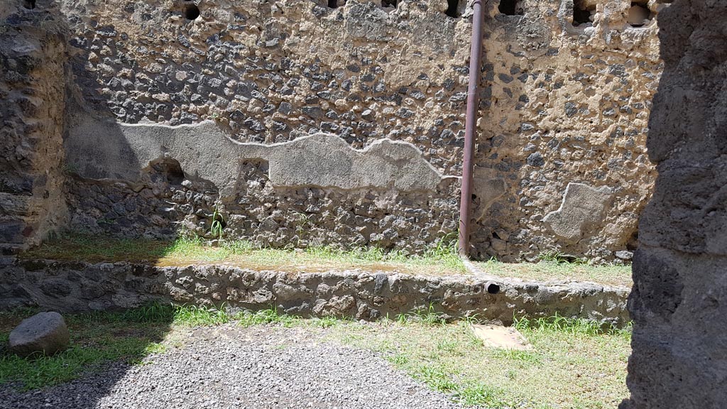 I.10.14 Pompeii. August 2023. Looking west through window in west wall of stable. Photo courtesy of Maribel Velasco.