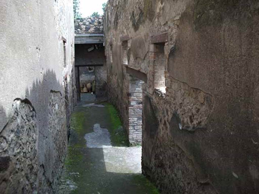 I.10.15 Pompeii. May 2010. Looking east along corridor from peristyle of I.10.4, leading to service quarters. 
