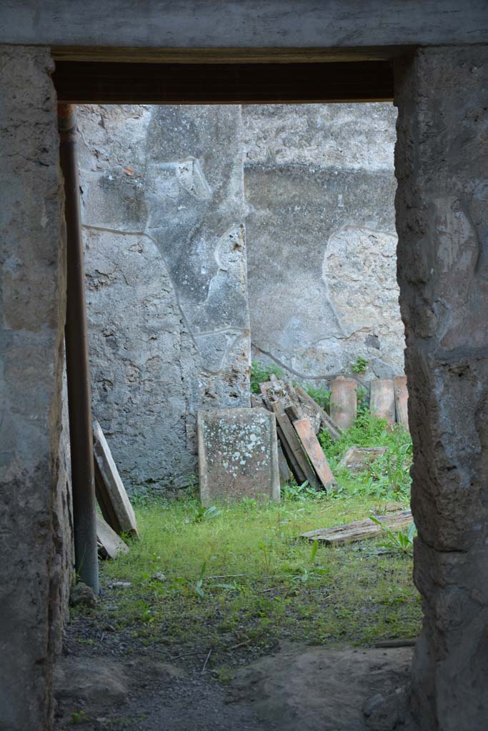 I.10.16 Pompeii. April 2017. Doorway to garden in west wall of atrium.
Photo courtesy Adrian Hielscher.

