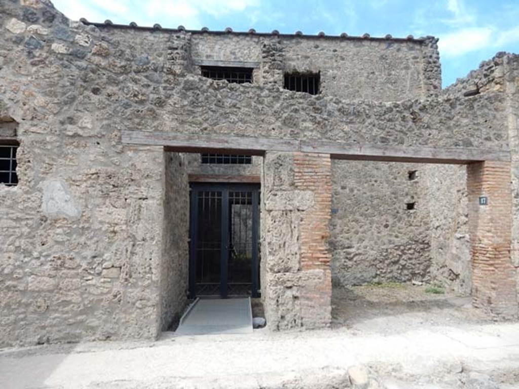 I.10.17 Pompeii, on right. May 2017. Looking west to shop entrance, with doorway to I.10.16, on left.  Photo courtesy of Buzz Ferebee. 
