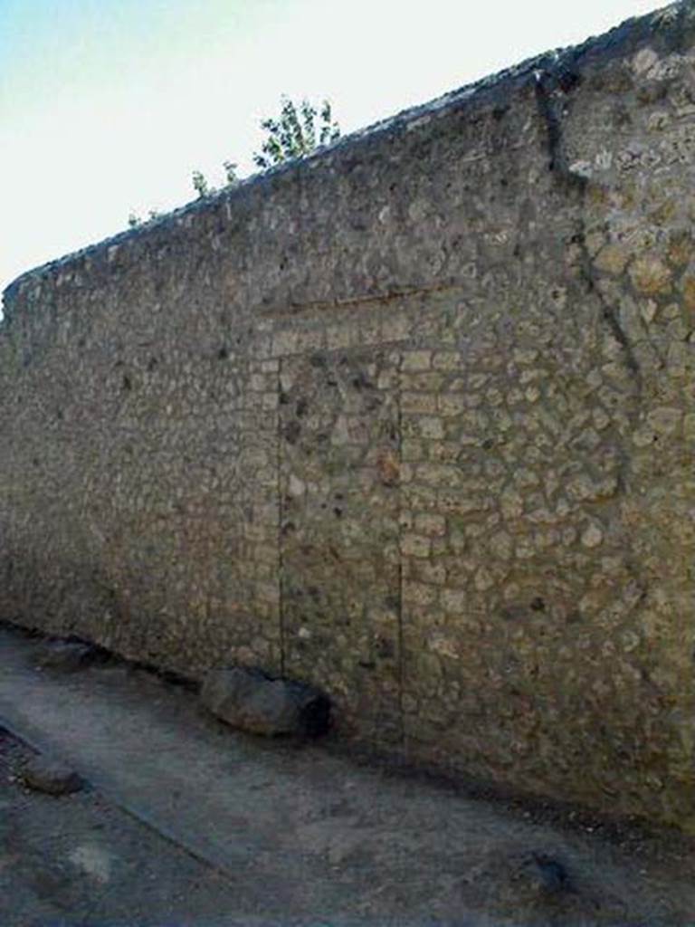 I.11.14 Pompeii. May 2005. Blocked doorway in exterior rear wall of house.