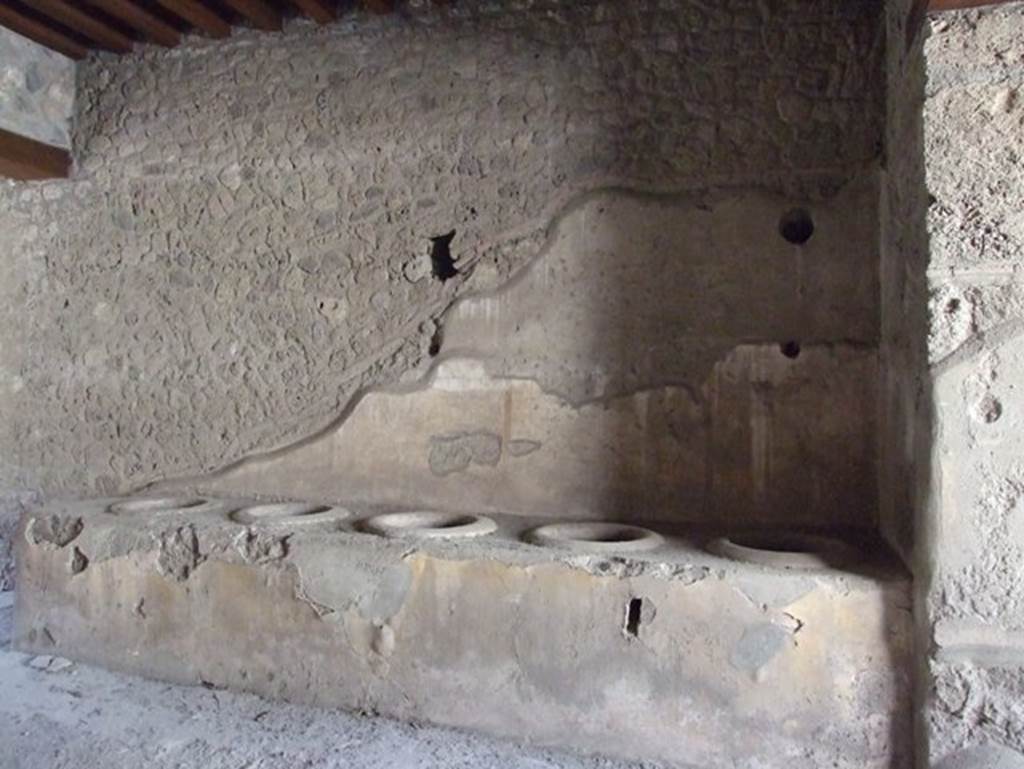 I.12.3 Pompeii.  March 2009.  Room 1. Caupona courtyard.  West wall.