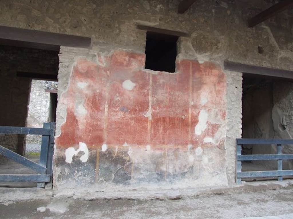 I.12.5 Pompeii. December 2006. Painted wall plaster between two doorways.     I.12.4
High up near the architrave, on the west side (right) of the doorway of I.12.5, a large painted head was found.
This showed the personification of Alessandria, or of Egypt.
On the left side of the large painted head was a painted Mercury,
Many graffiti were recorded from the walls between I.12.5 and I.12.4.
See Notizie degli Scavi di Antichità, 1914, (p.181-2)
See Varone, A. and Stefani, G., 2009. Titulorum Pictorum Pompeianorum, Rome: L’erma di Bretschneider. (p.154-5)

