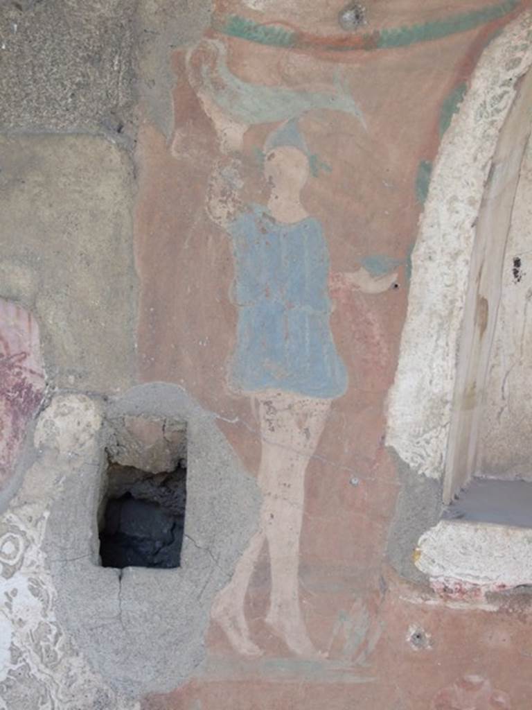 I.12.15 Pompeii.  March 2009. North side of Lararium niche. Lar with painted garland above his head.