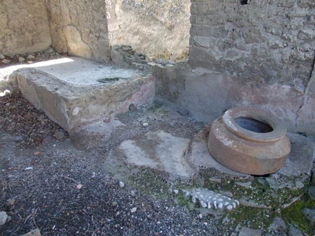 I.12.15 Pompeii. March 2009. Room 5, west wall, with window to triclinium, couch and cistern.