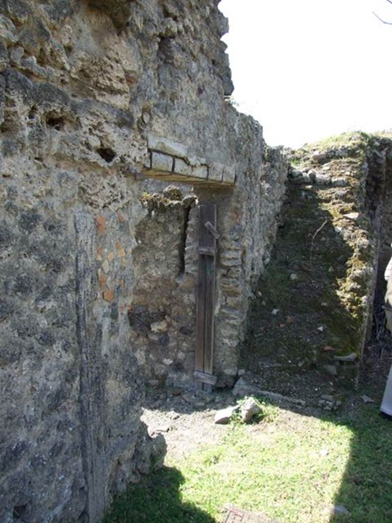 I.12.15 Pompeii.  March 2009.  Staircase looking west, and doorway from garden to atrium.