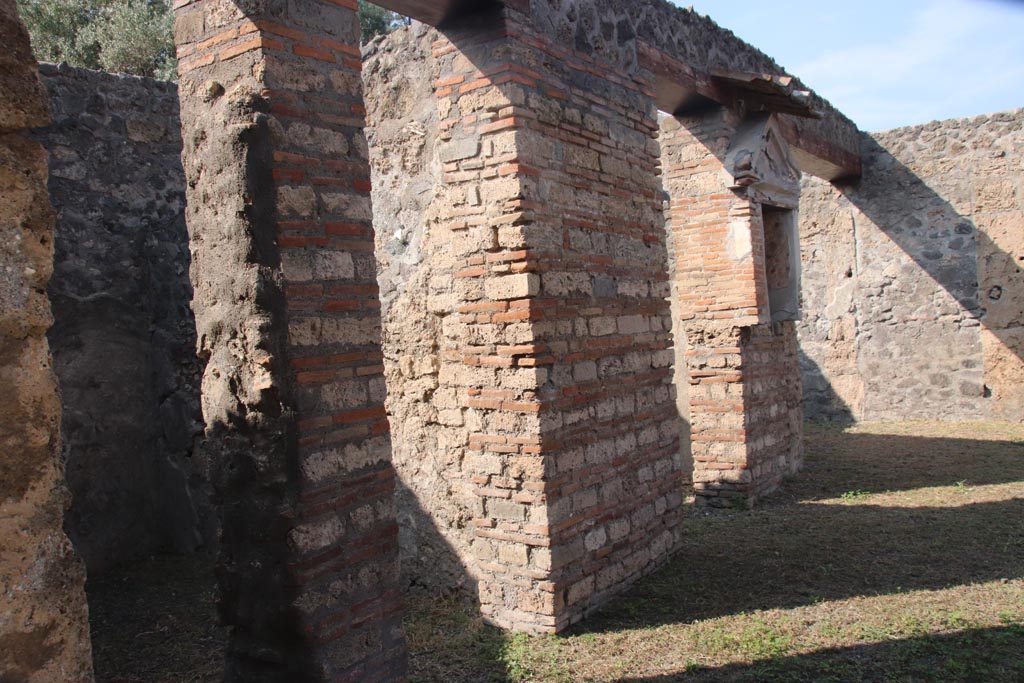 I.13.12 Pompeii. October 2023. Looking north along west side of atrium towards the lararium. Photo courtesy of Klaus Heese.