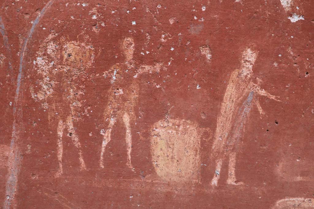I.14.7 Pompeii. December 2018. Detail from lararium, right to left. 
A man in a long garment, making a gesture in direction of the weighing machine/scales.
A second man in a short robe with outspread arms making a gesture over a basket and another man carrying a basket on his left shoulder. 
Photo courtesy of Aude Durand.
