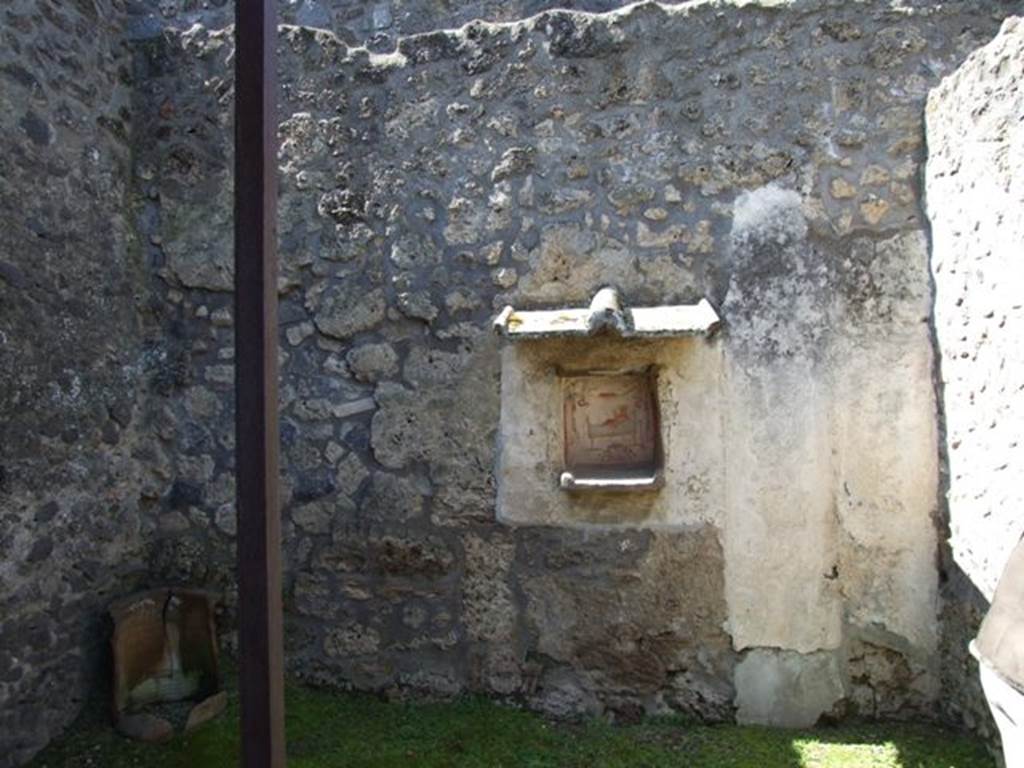 I.14.7 Pompeii. March 2009. West wall of the garden area with another niche lararium. 
