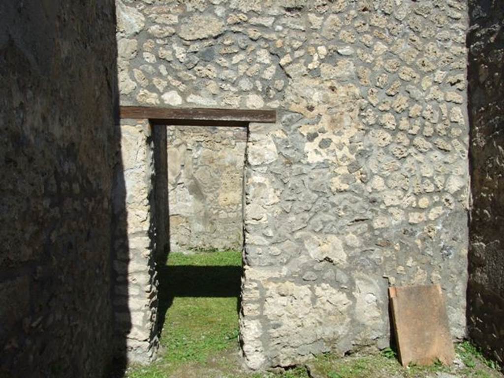 I.14.7 Pompeii.  March 2009.  Windowed triclinium, north wall with door to south west corner of atrium.